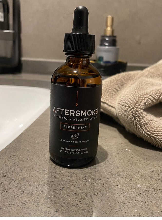AfterSmoke bottle on a bathroom counter